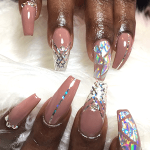 Long pink nails with silver glitter and rhinestones.